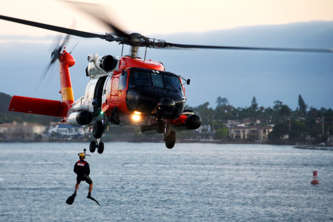 Coast Guard personnel conduct a search and rescue demonstration from an MH-60T Jayhawk helicopter in San Diego, Aug. 10, 2019.  